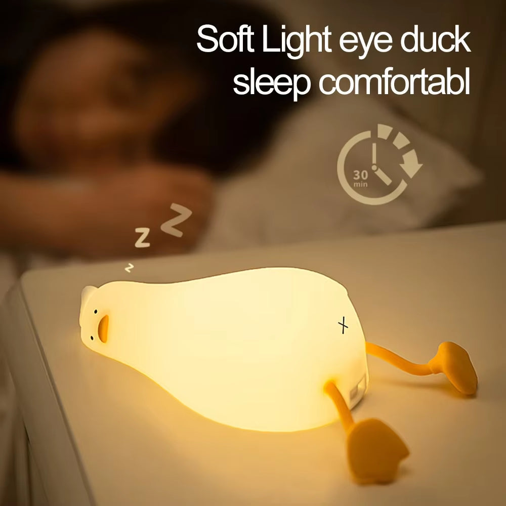 Flat Duck Nightlight. Soft squiggy silicone, touch activated, 30 minute timer, rechargable, book holder, phone holder. Great for kids, teenagers and adults.