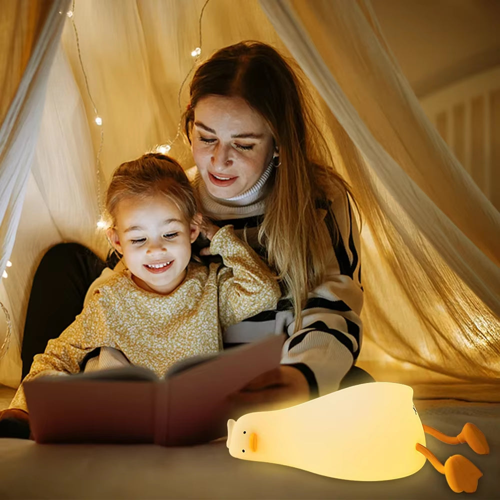 Flat Duck Nightlight. Soft squiggy silicone, touch activated, 30 minute timer, rechargable, book holder, phone holder. Great for kids, teenagers and adults.