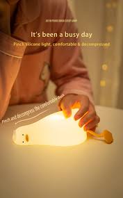 Flat Duck Nightlight. Soft squiggy silicone, touch activated, 30 minute timer, rechargable, book holder, phone holder. Great for kids, teenagers and adults.