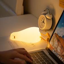 Flat Duck Nightlight. Soft squiggy silicone, touch activated, 30 minute timer, rechargable, book holder, phone holder. Great for kids, teenagers and adults.