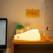 Flat Duck Nightlight. Soft squiggy silicone, touch activated, 30 minute timer, rechargable, book holder, phone holder. Great for kids, teenagers and adults.