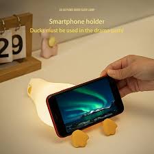 Flat Duck Nightlight. Soft squiggy silicone, touch activated, 30 minute timer, rechargable, book holder, phone holder. Great for kids, teenagers and adults.