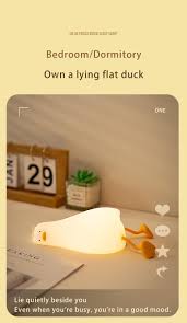 Flat Duck Nightlight. Soft squiggy silicone, touch activated, 30 minute timer, rechargable, book holder, phone holder. Great for kids, teenagers and adults.