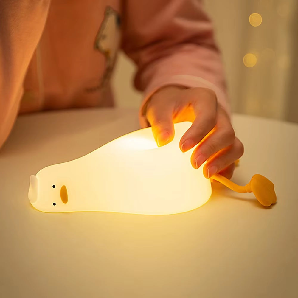 Flat Duck Nightlight. Soft squiggy silicone, touch activated, 30 minute timer, rechargable, book holder, phone holder. Great for kids, teenagers and adults.
