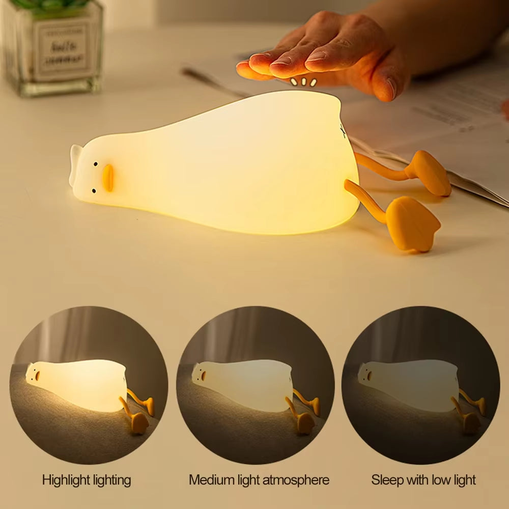 Flat Duck Nightlight. Soft squiggy silicone, touch activated, 30 minute timer, rechargable, book holder, phone holder. Great for kids, teenagers and adults.