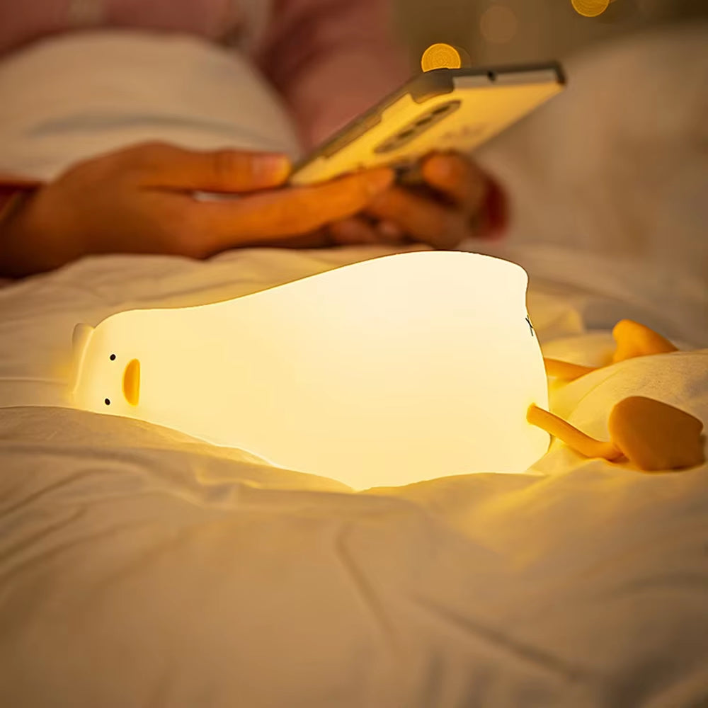 Flat Duck Nightlight. Soft squiggy silicone, touch activated, 30 minute timer, rechargable, book holder, phone holder. Great for kids, teenagers and adults.